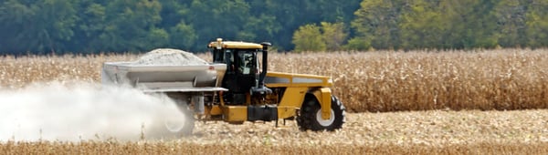 Lime spreader applying lime. 